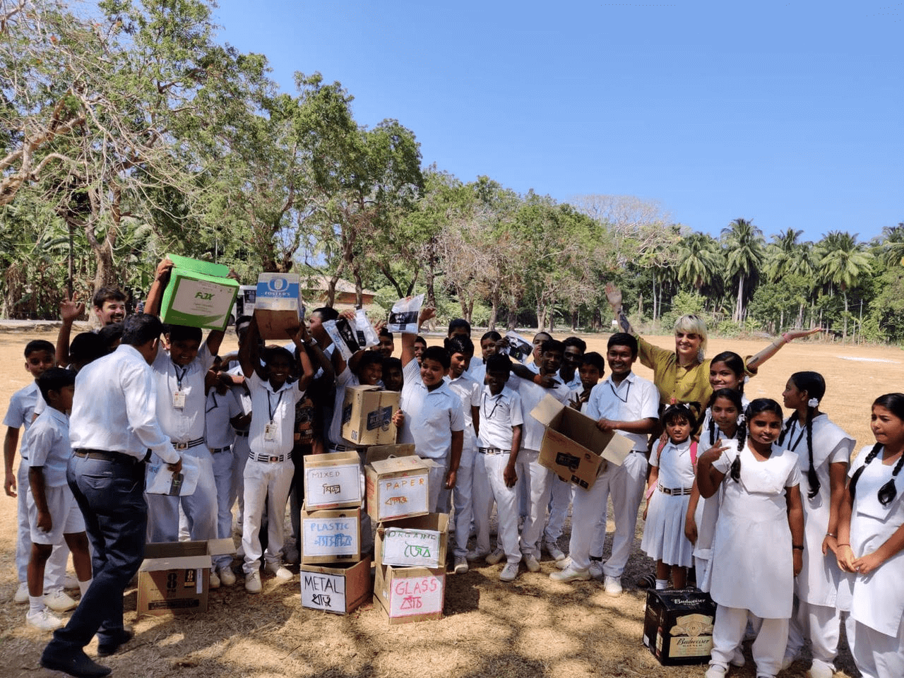 Children helping in waste segregation and recycling of waste with Katleen.